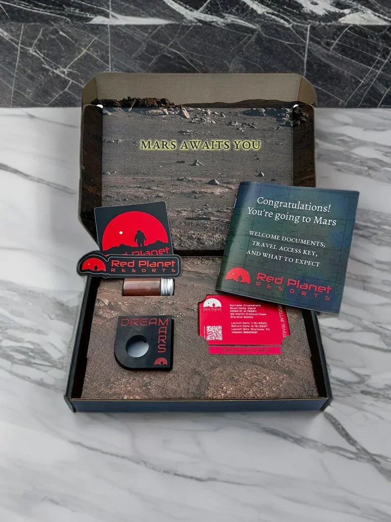 Mars-themed gift box with Red Planet Resorts stickers, travel key, and Mars travel booklet