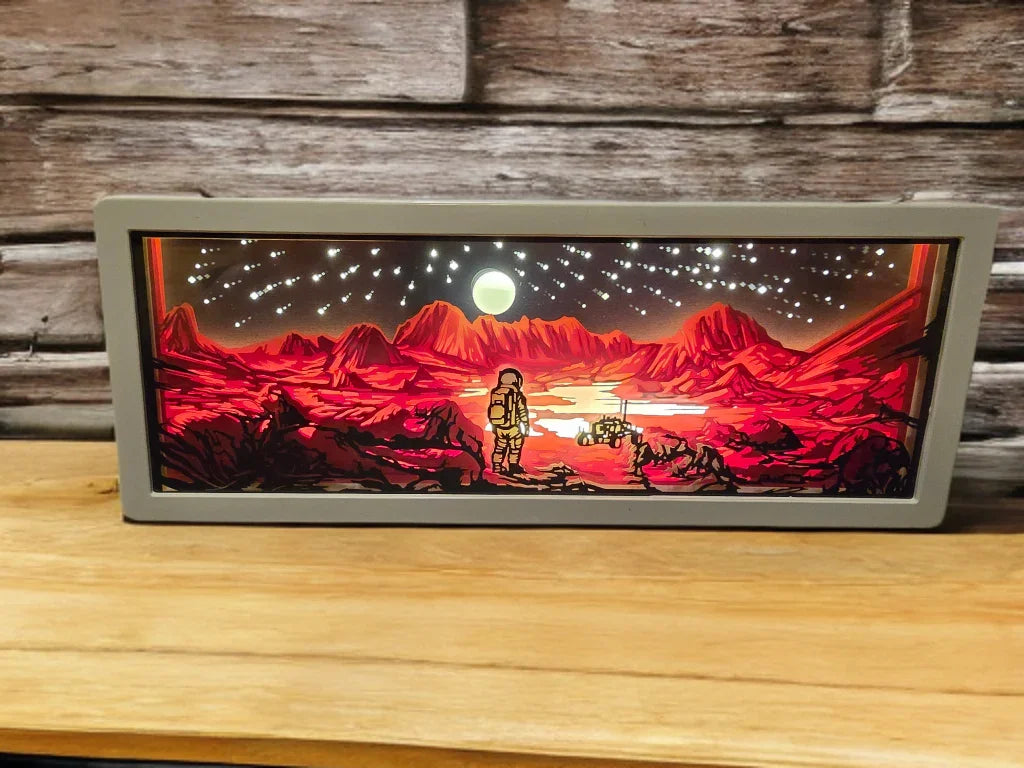 Lightbox displaying astronaut on red Martian landscape with mountains, full moon, and starry sky