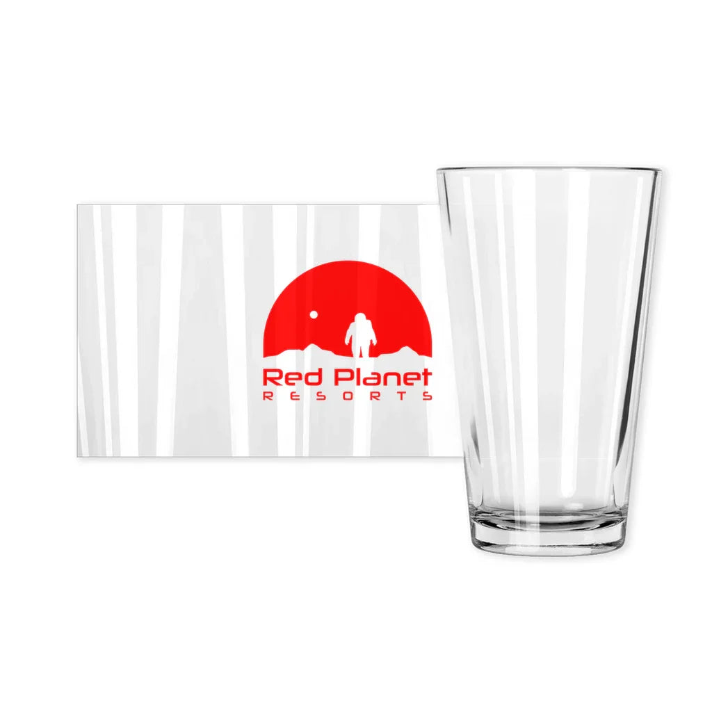 Clear drinking glass next to Red Planet Resorts logo with red astronaut graphic on white background
