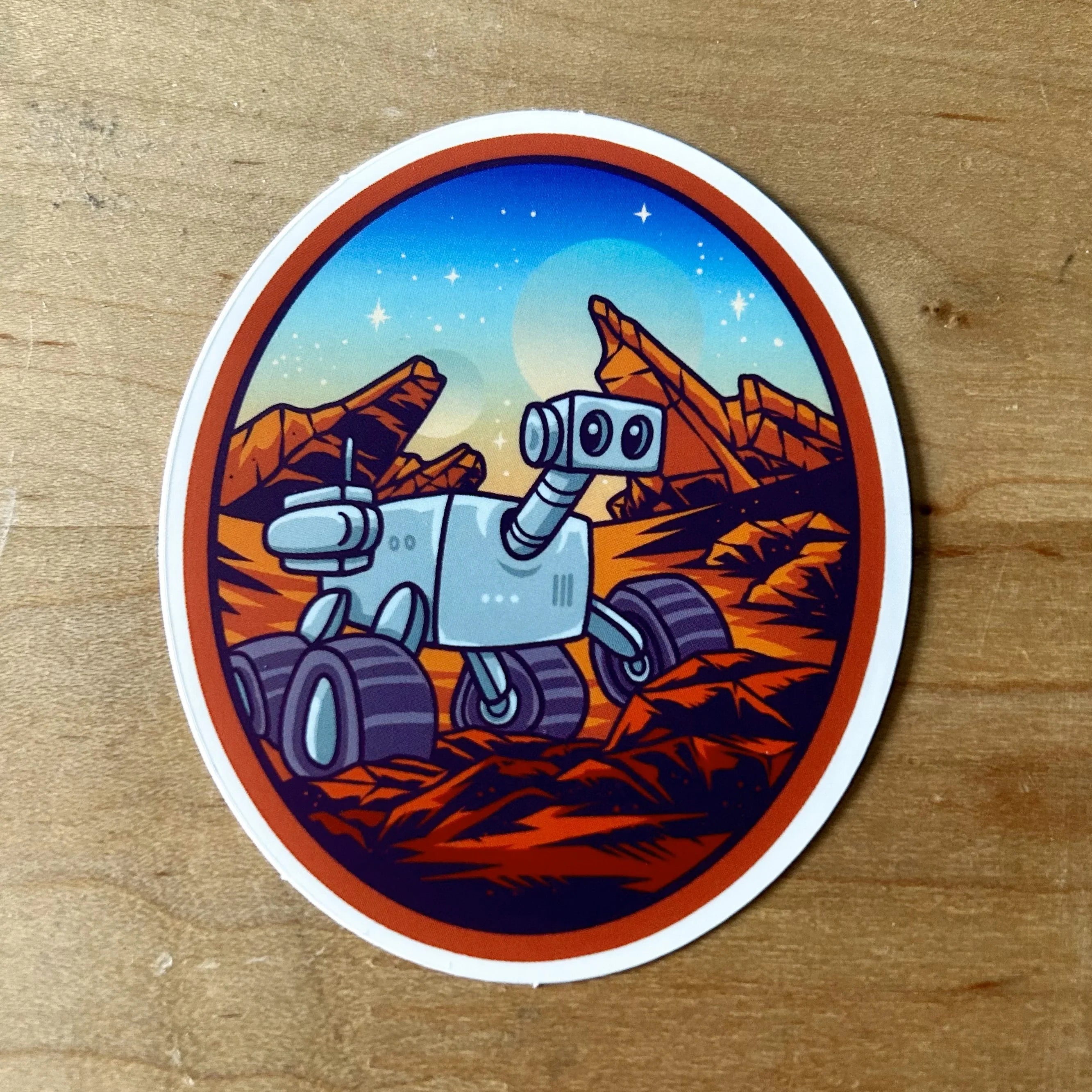 Sticker of a cartoon Mars rover exploring red rocky Martian landscape under a starry sky
