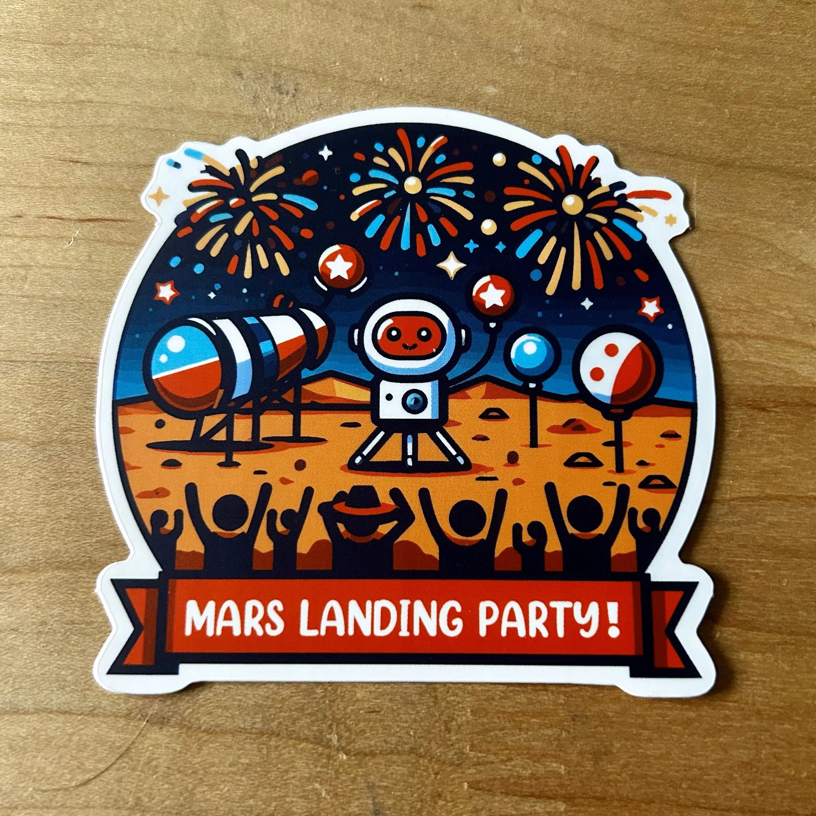 Sticker of a Mars landing party with an astronaut, rockets, fireworks, balloons, and cheering crowd