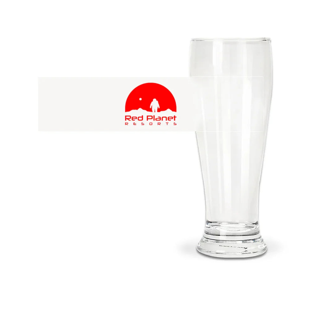 Tall clear pilsner glass with Red Planet Resorts logo label featuring astronaut and red planet graphic