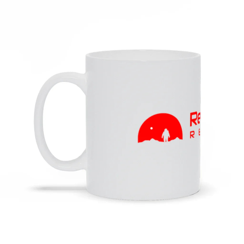 White ceramic mug with red astronaut graphic and partial red text on the side